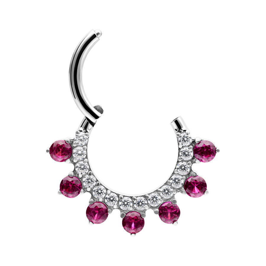 Aro de piercing plateado con cristales rojos sobre fondo blanco