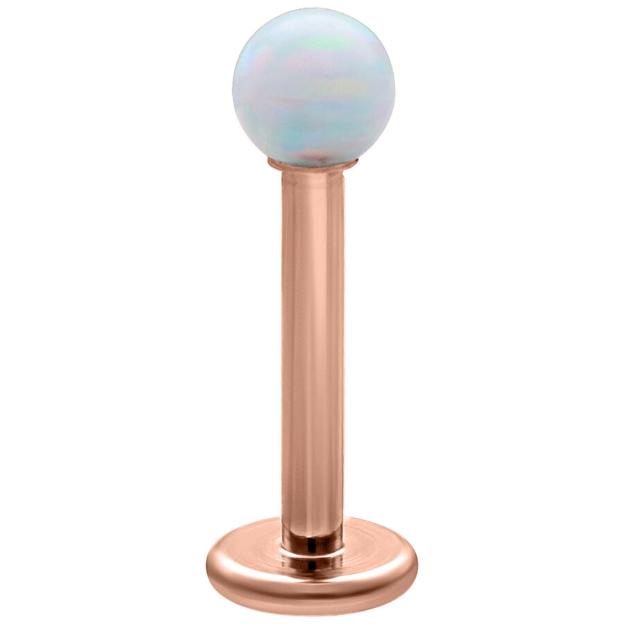 Labret con ópalo sintético blanco y barra de titanio recubierta de oro rosa sobre fondo blanco
