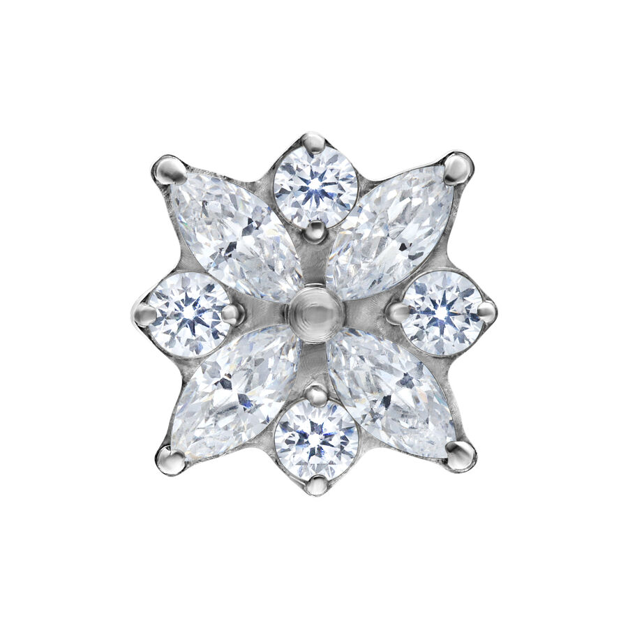 Top argento a forma di fiore con cristalli chiari su sfondo bianco