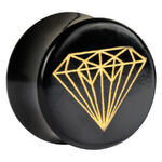 Plug de cuerno negro con diseño de diamante dorado sobre fondo blanco