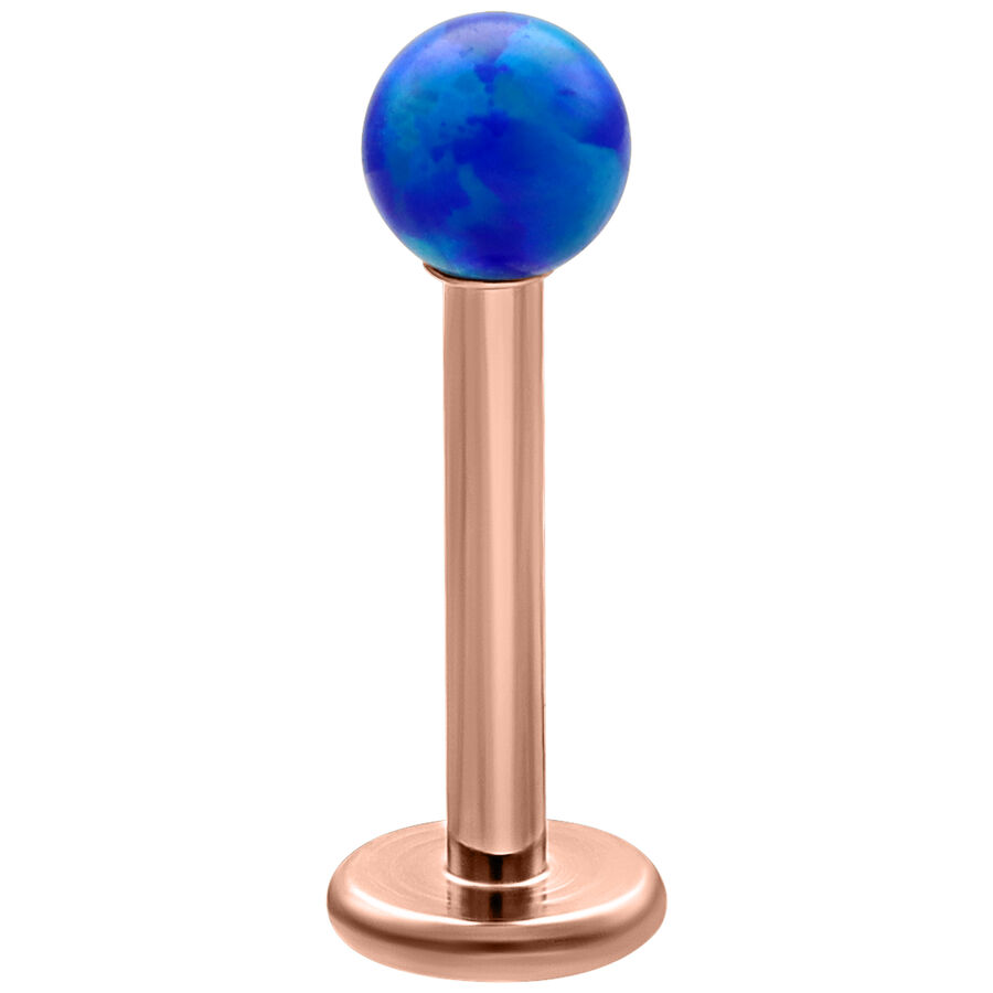 Labret de bola de ópalo azul oscuro en barra de titanio oro rosa, fondo de estudio