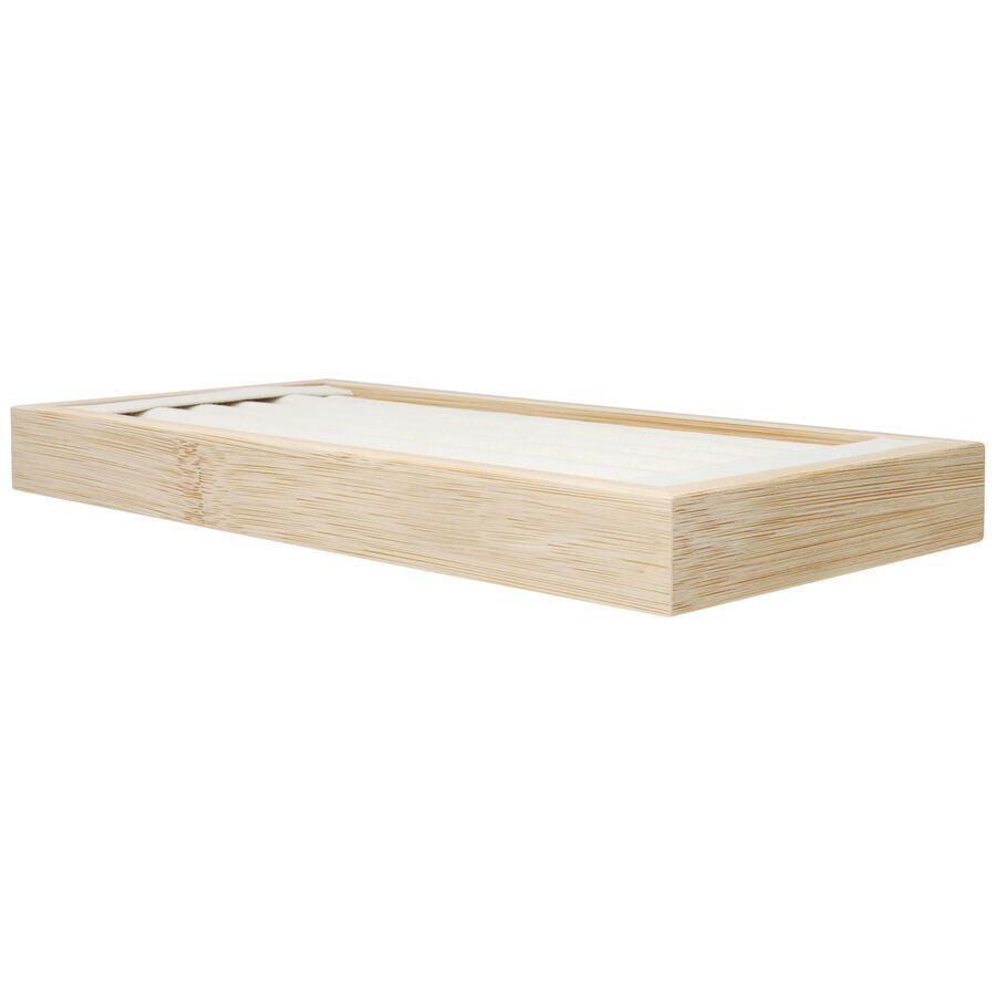 Espositore nero per anelli in legno con scanalature su sfondo bianco