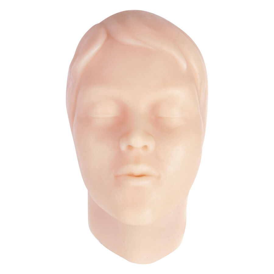 Forma del viso in silicone beige per esercitazioni di tatuaggio su sfondo bianco