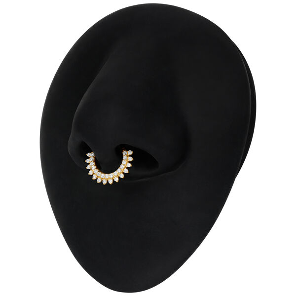 Aro de septum dorado con Moissanita y diseño de rayos de sol sobre fondo negro