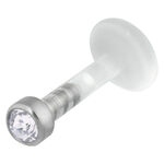 Labret de Bioplast con piedra cristalina y accesorio de titanio sobre fondo blanco