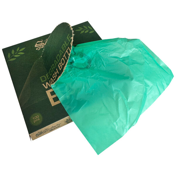 Sacchetti per lavaggio biodegradabili verdi su cartone