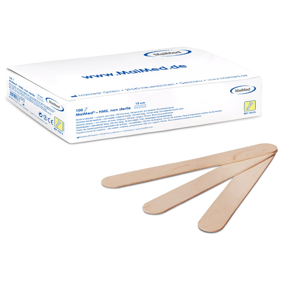 Tre spatole di legno davanti a una confezione bianca con scritta blu