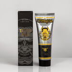 Tubo con Aloe Tattoo Tattoofilm e confezione su sfondo grigio