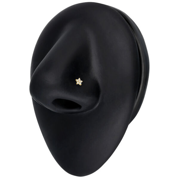Aro de nariz de oro con flor de Moissanite sobre fondo negro