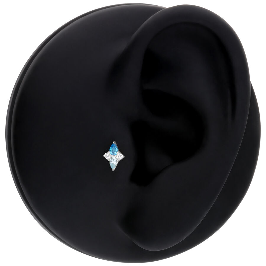 Accesorio Push Fit plateado con cristal turquesa sobre fondo negro