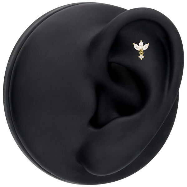 Aro de loto de oro con Moissanite sobre display de oreja negro