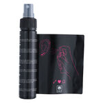 Botella de spray para piercings e instrucciones con dibujo sobre fondo blanco