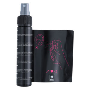 Wildcat Piercingspray Set 60ml mit Anleitung Piercingspray Flasche und Anleitung mit Zeichnung auf weißem Hintergrund