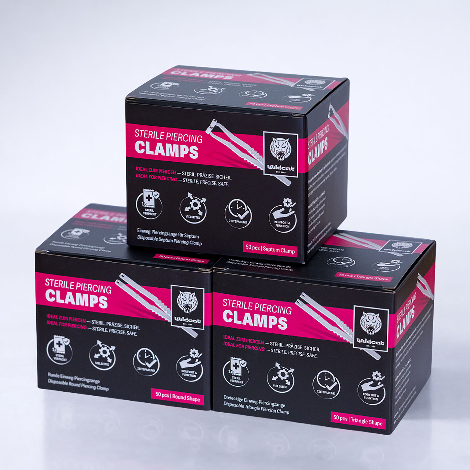 Sterile Triangel Piercingzangen - 50er Set Drei schwarze Boxen mit Aufschrift 'Sterile Piercing Clamps' auf weißem Hintergrund