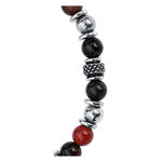 Pulsera de acero quirúrgico con piedras negras y rojas sobre fondo blanco