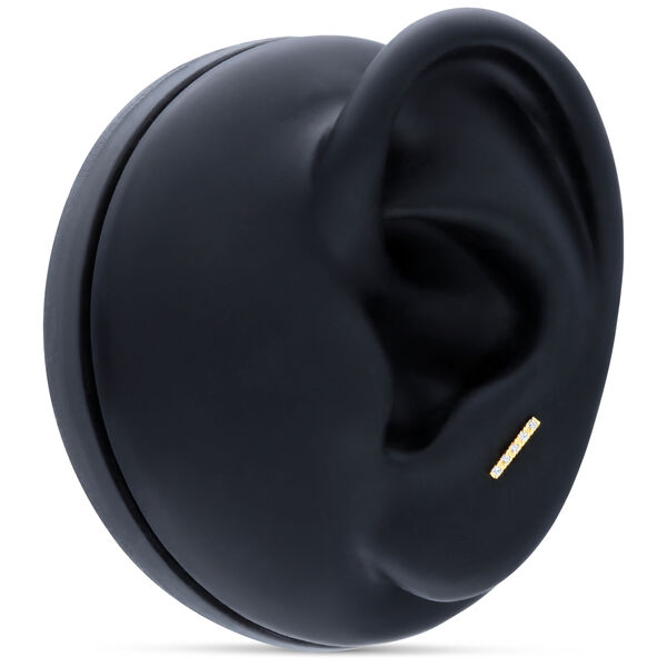 18K kultainen korvakoru, jossa viisi kirkasta kristallia mustalla taustalla