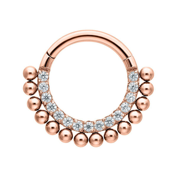 Piercing clicker de oro rosa con cristales claros sobre fondo blanco