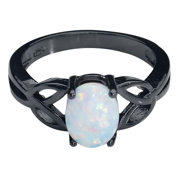 Anello nero in acciaio chirurgico con opale bianco su sfondo neutro