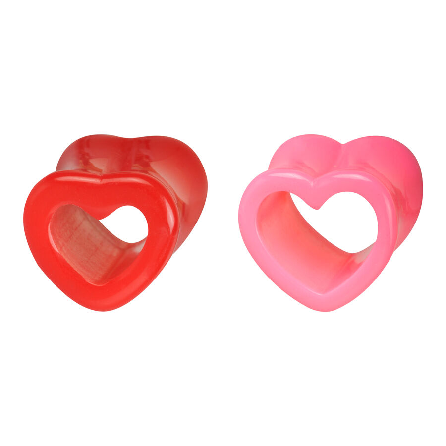 Due tunnel acrilici a forma di cuore in rosso e rosa su sfondo bianco