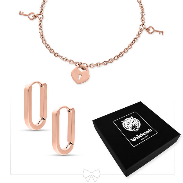 Pulsera en oro rosa con diseño de candado y llave junto a pendientes en oro rosa y una caja negra de Wildcat