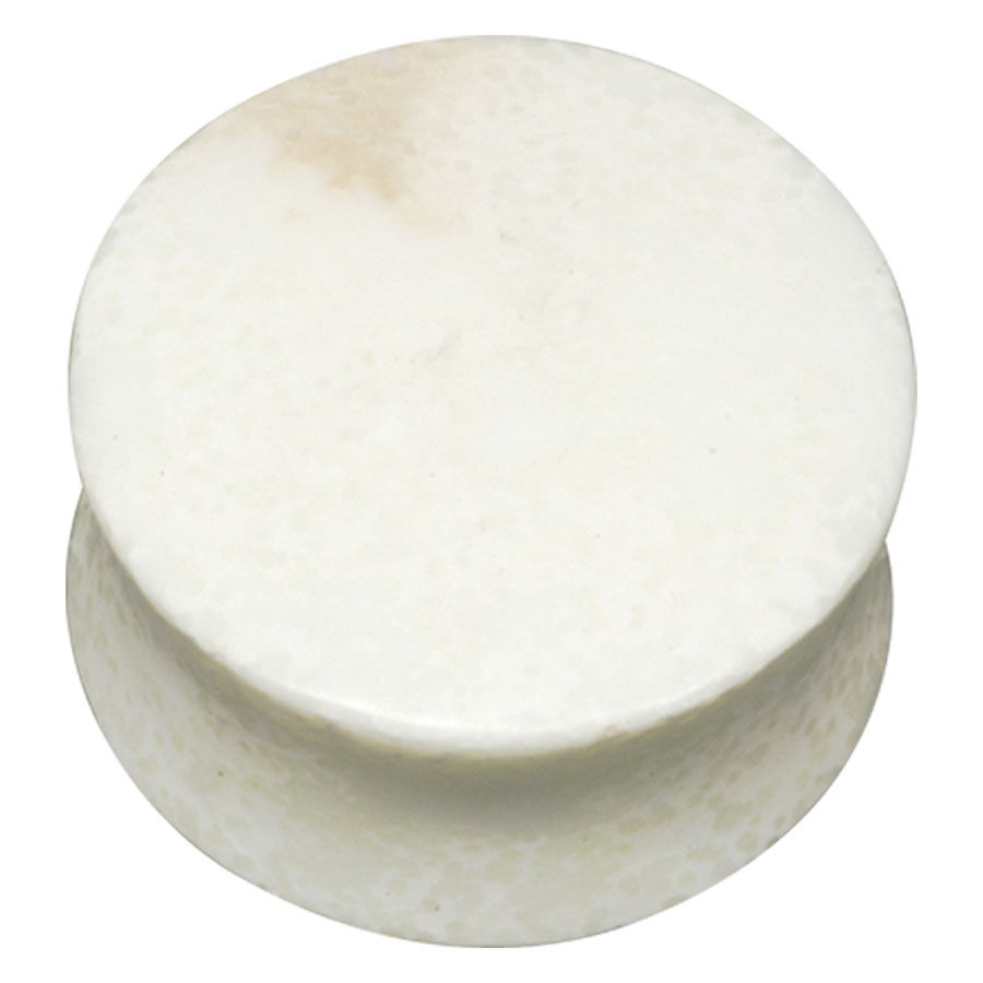 Pyöreä Lemon Chrysoprase -plugi vaaleassa kivessä valkoisella taustalla