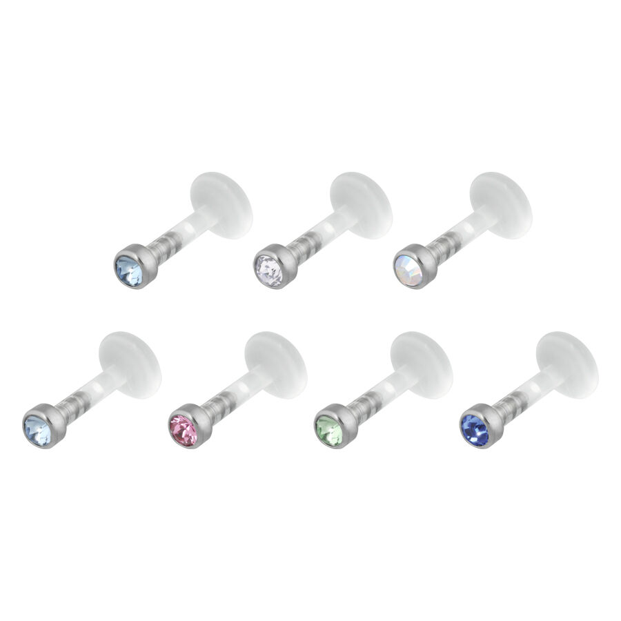Seis Labrets Push-Fit con cristales de varios colores sobre fondo blanco