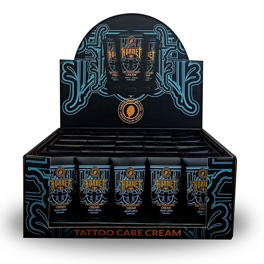 Caja negra con tubos de Crema de Cuidado para Tatuajes Hornet y decoraciones azules