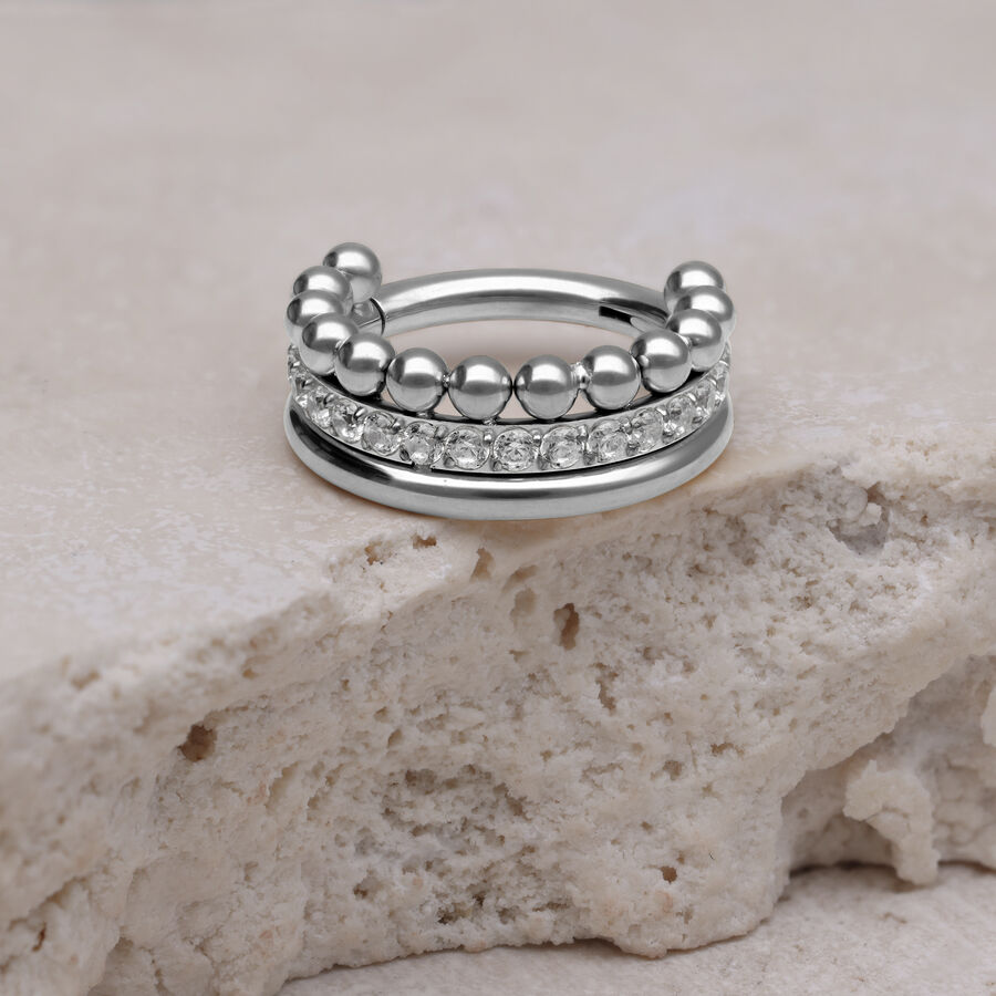 Silberner Triple Bubble Crystal Clicker auf hellem Stein